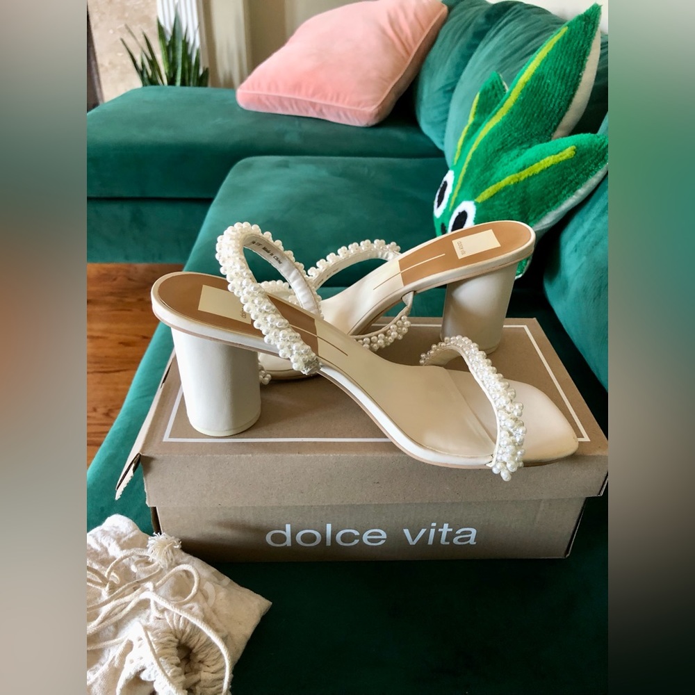 Ivory block heel with double pearl accented straps.